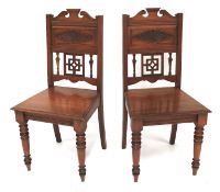 Two mahogany hall chairs.