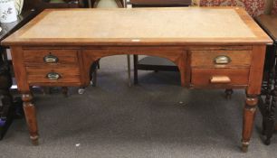 A large mid-century oak desk.