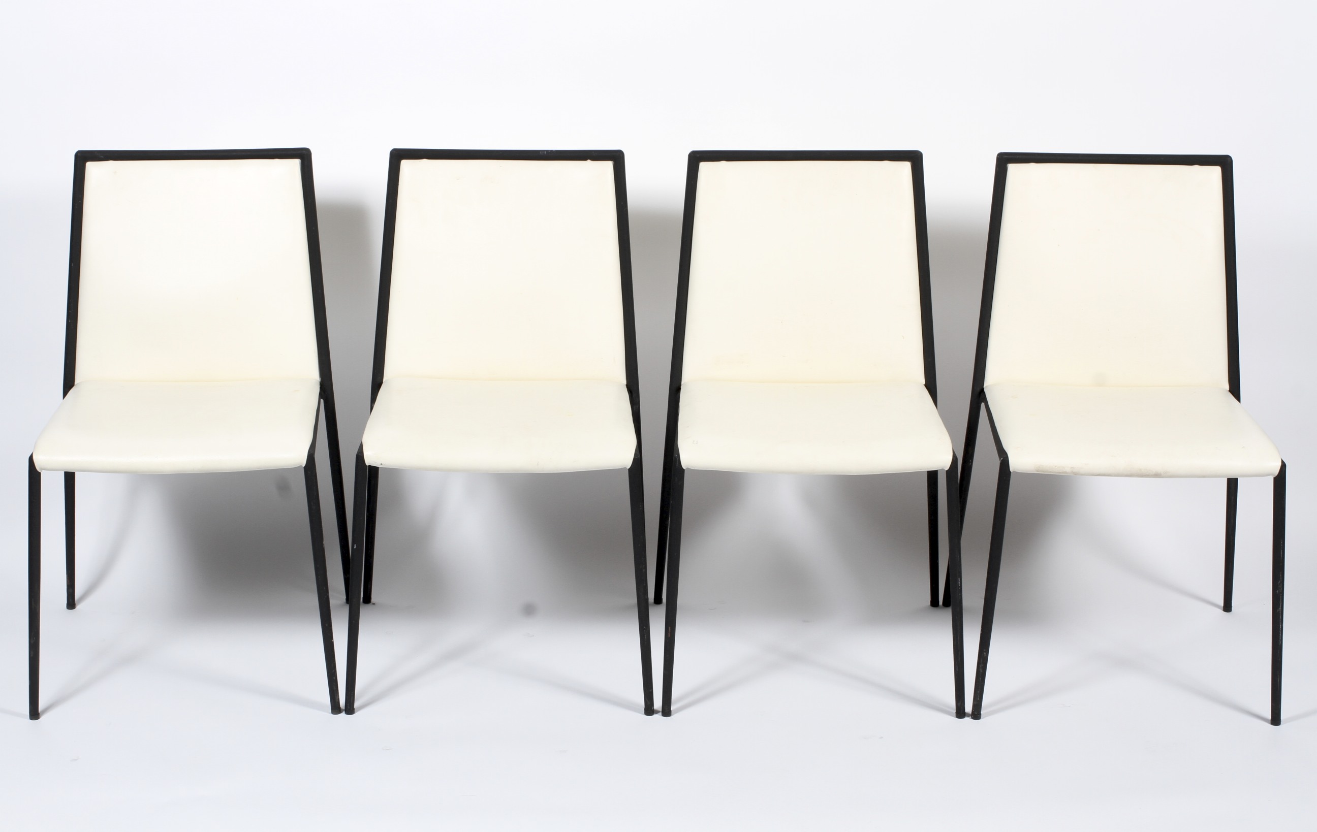 Four cream upholstered black framed dining chairs. H81.