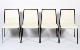 Four cream upholstered black framed dining chairs. H81.