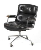 A chrome and black leather adjustable swivel chair.