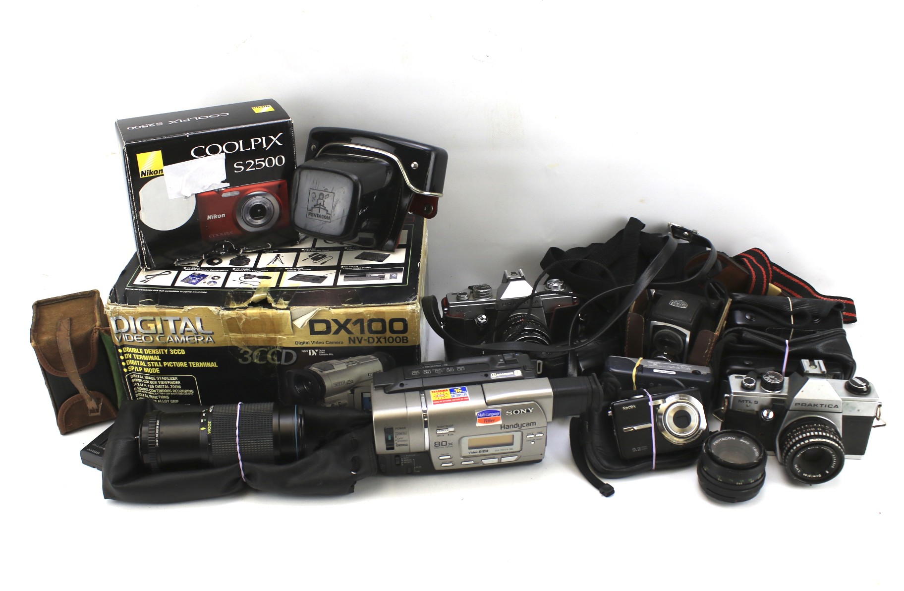 Assorted cameras and lenses. Including a Boxed Brownie, two Praktica full view, Ross Ensign, etc.
