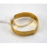 A 20th century 22ct gold wedding band. Weight 2.