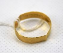 A 20th century 22ct gold wedding band. Weight 2.