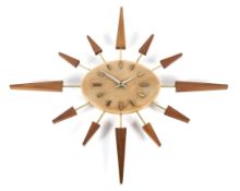 A mid-century Manley sunburst wall clock.