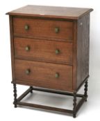 A mid-century oak chest of drawers.