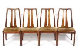 Four Nathan teak dining chairs.