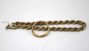 A 9ct gold wedding band ring and part of a 9ct gold rope twist chain.