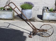 A cast metal plough.