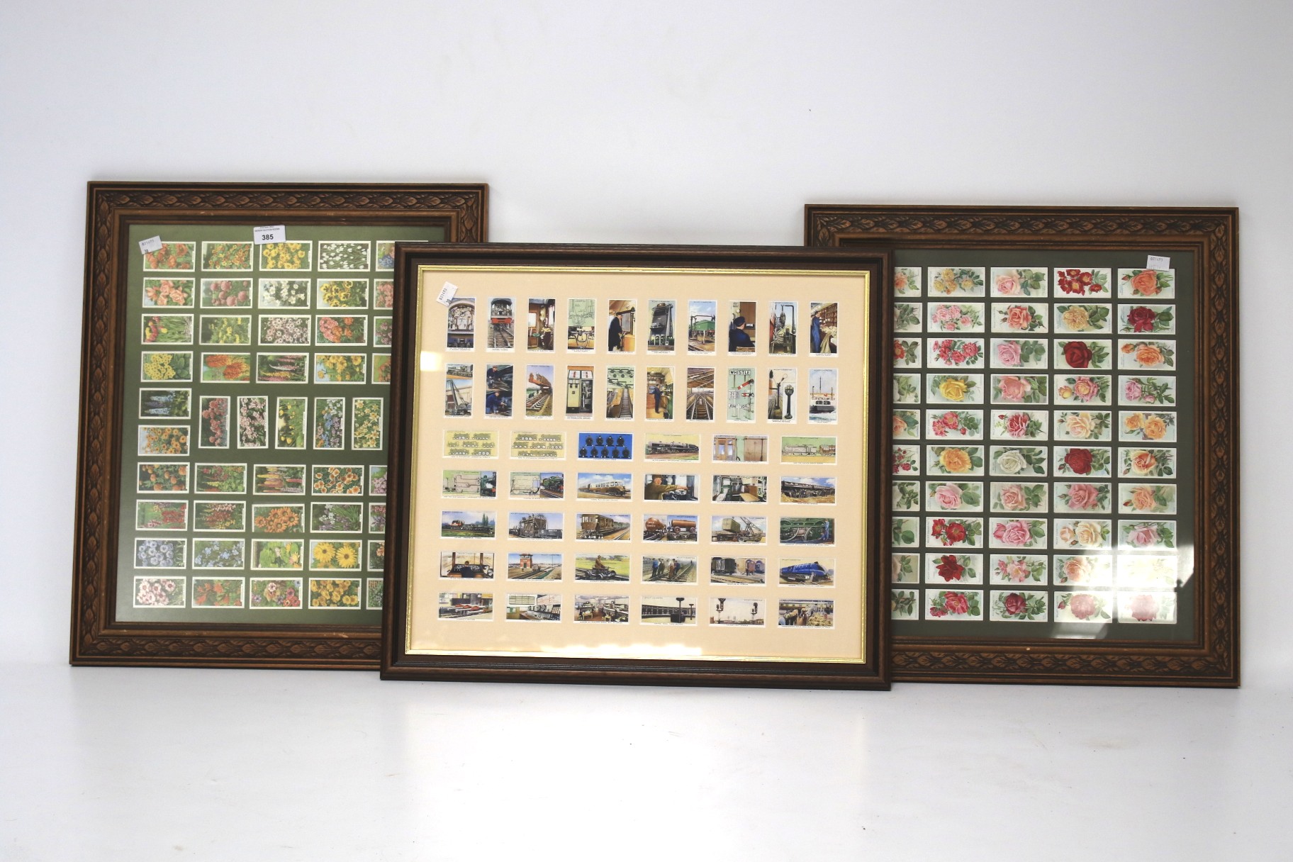 Three sets of cigarette cards featuring flowers and railway equipment.