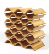 An Ethos bent plywood wave shaped tiered wine rack.