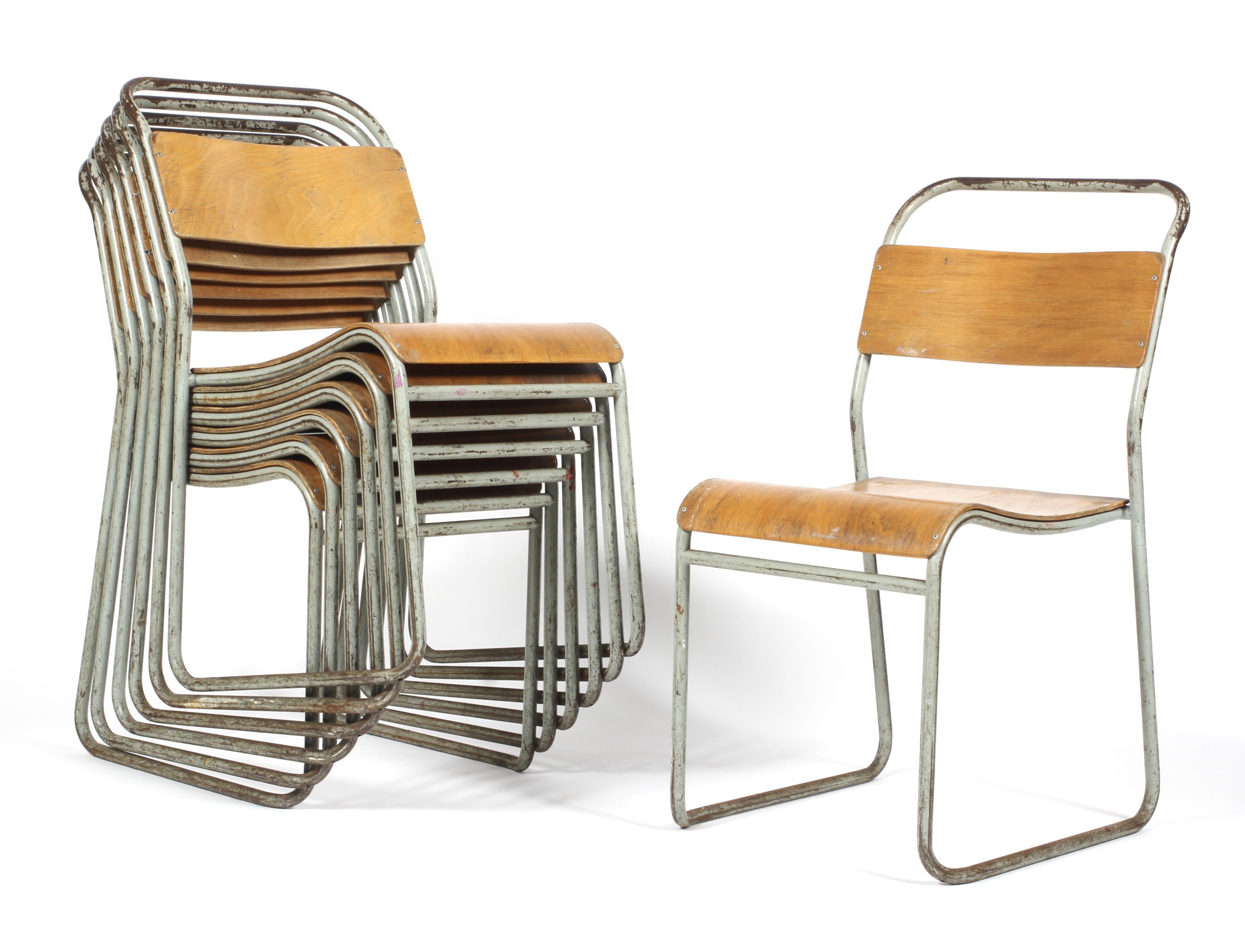 Seven mid-20th century REL vintage steel framed and bent plywood stackable chairs.