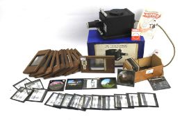 A 'Heathwood' 35mm Film-Strip Projector and a collection of magic lantern slides.