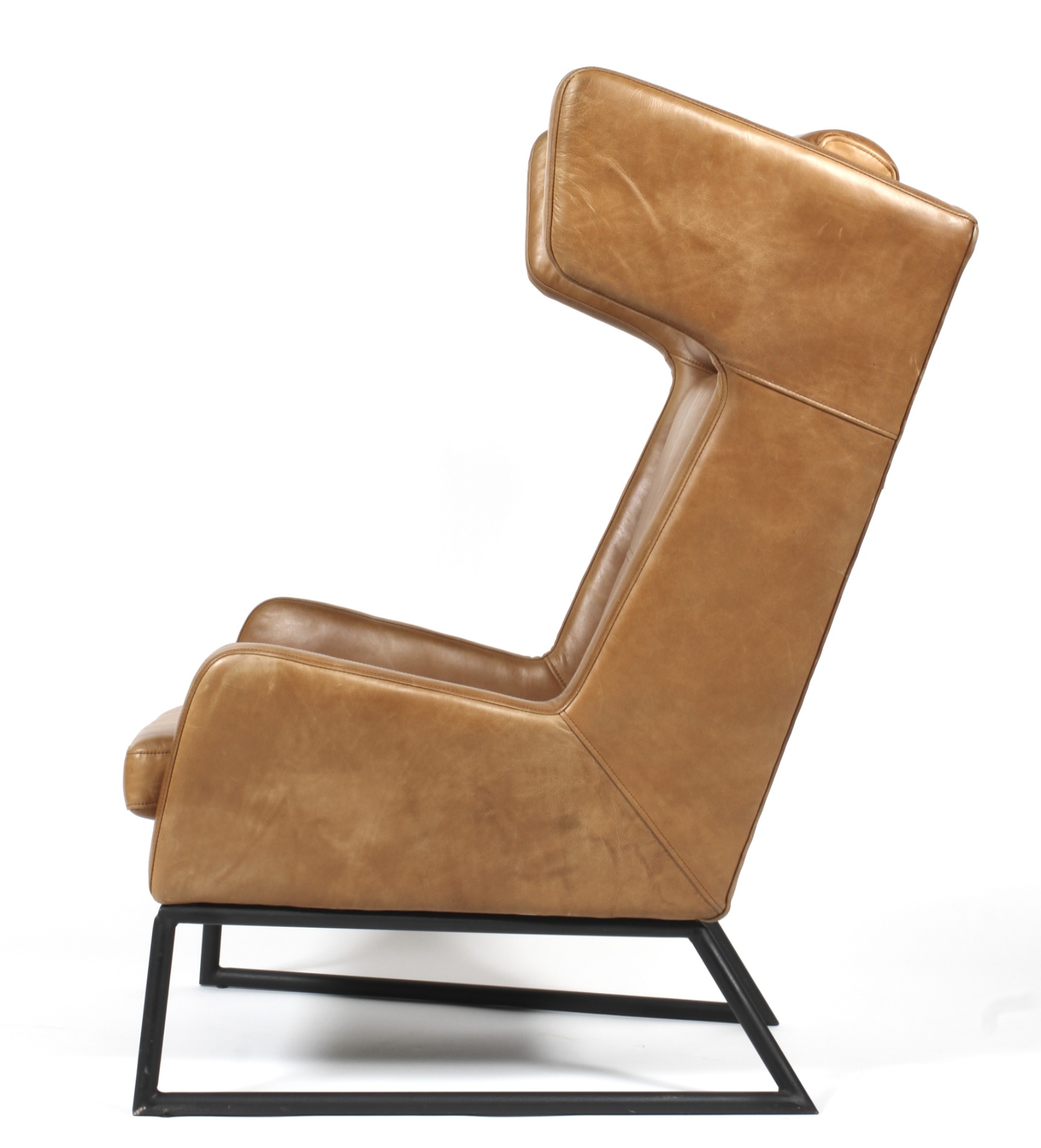 A contemporary tan leather upholstered chair. - Image 2 of 2