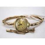 A vintage 9ct gold cased 'Long Swansea' ladies wristwatches.