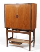 A mid-century teak drinks cabinet.