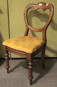 A Victorian mahogany balloon back chair.