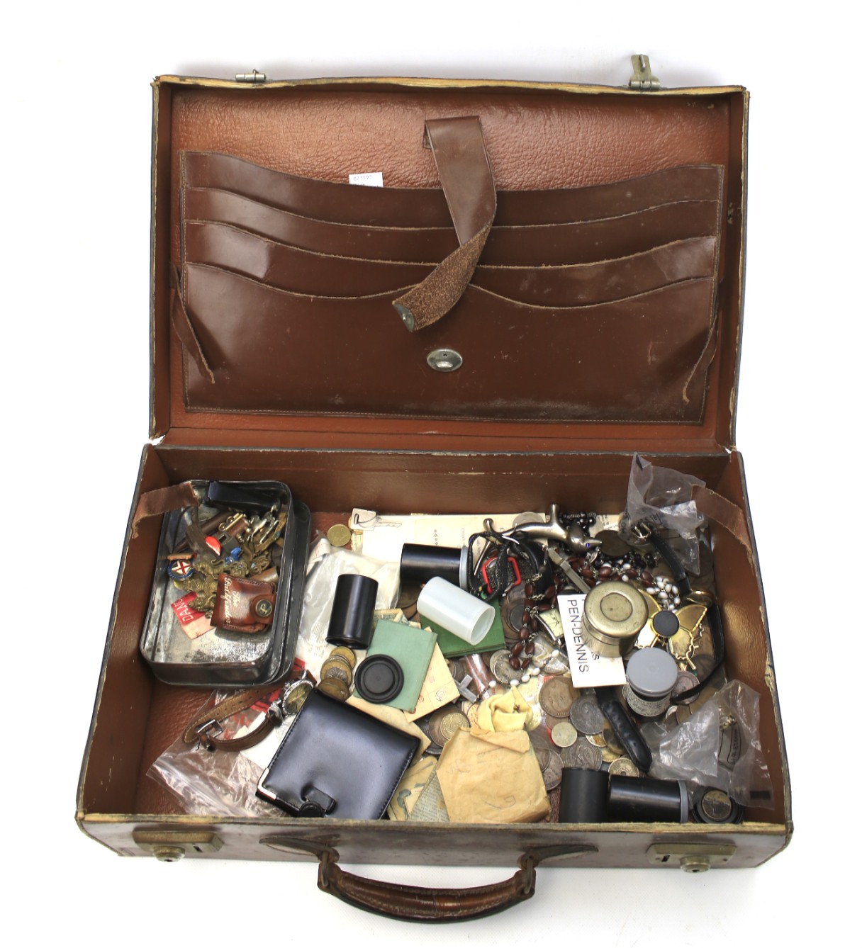 A vintage leather suitcase containing an assortment of collectables.