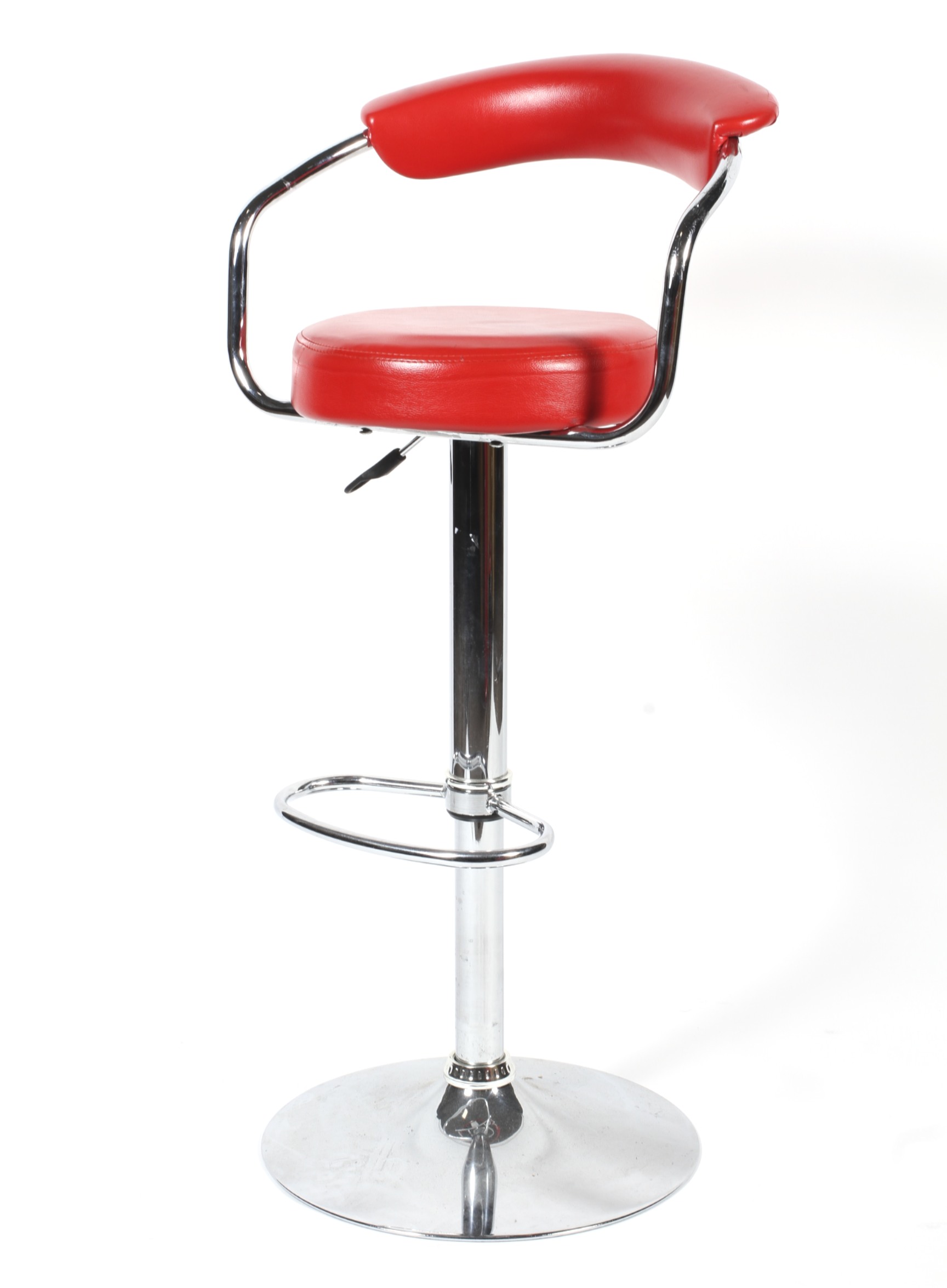 A chrome adjustable bar stool of tubular form upholstered in faux red leather.