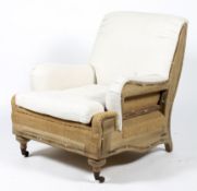 A contemporary stripped timber framed armchair.