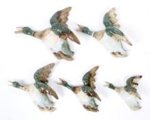Five Royal Dux wall mounted ducks in flight.