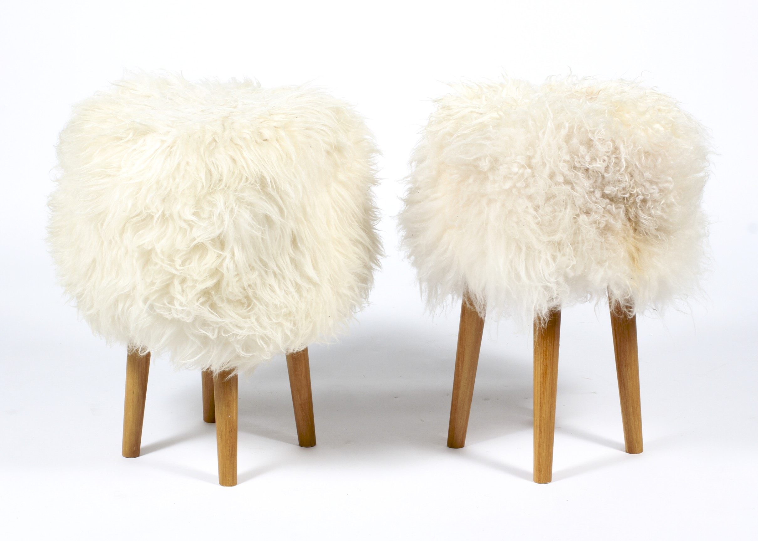 Two contemporary upholstered stools.