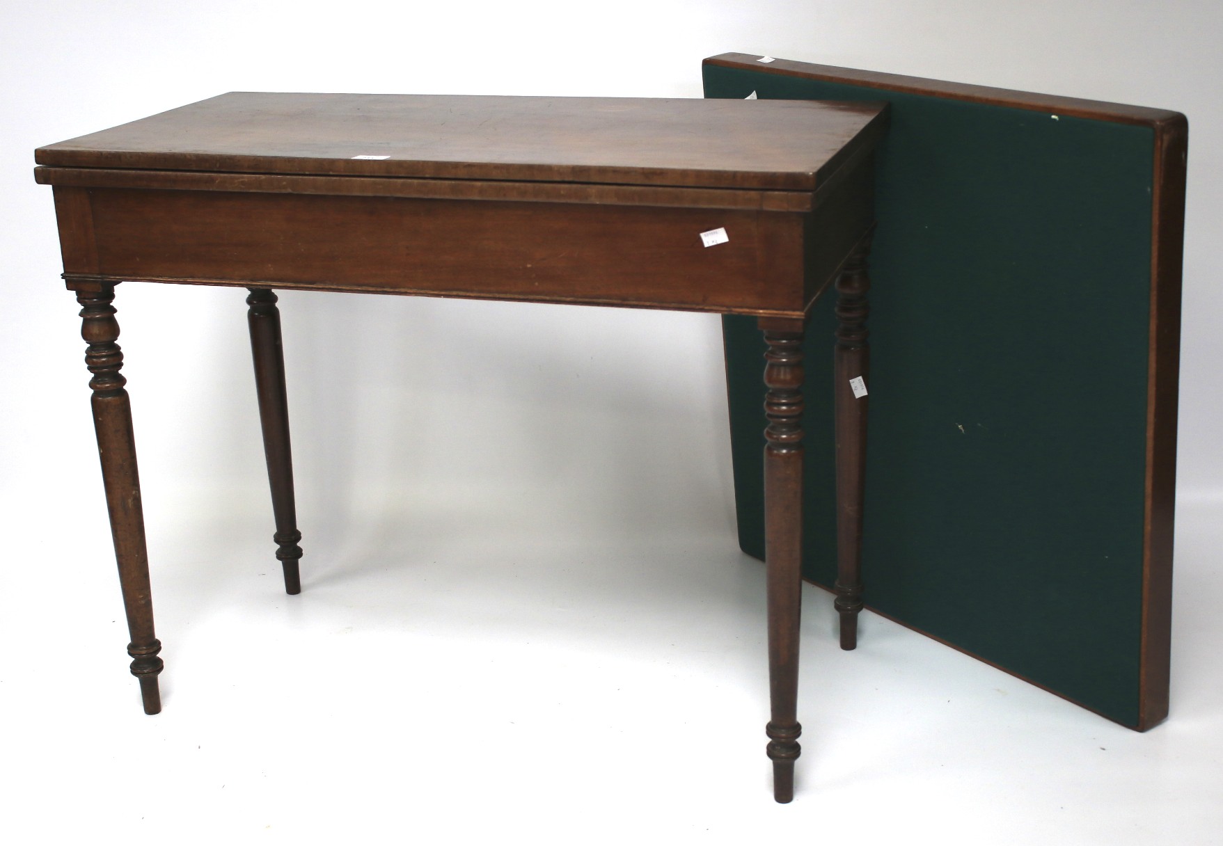 A 20th century mahogany games table and a card table.