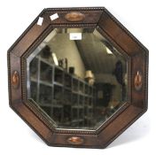 An oak framed bevelled edge wall mirror.