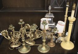 Four table lamps, a pair of candlesticks and a pair of wall brackets.