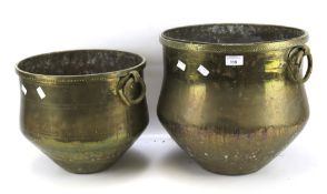 Two cast metal cauldron pots.