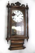 A 20th century mahogany wall clock.