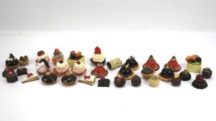 A collection of vintage French patisserie miniature shop counter display cakes.