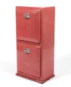 A Dulton Co Ltd pink metal cabinet designed by Yasu Sasamoto.
