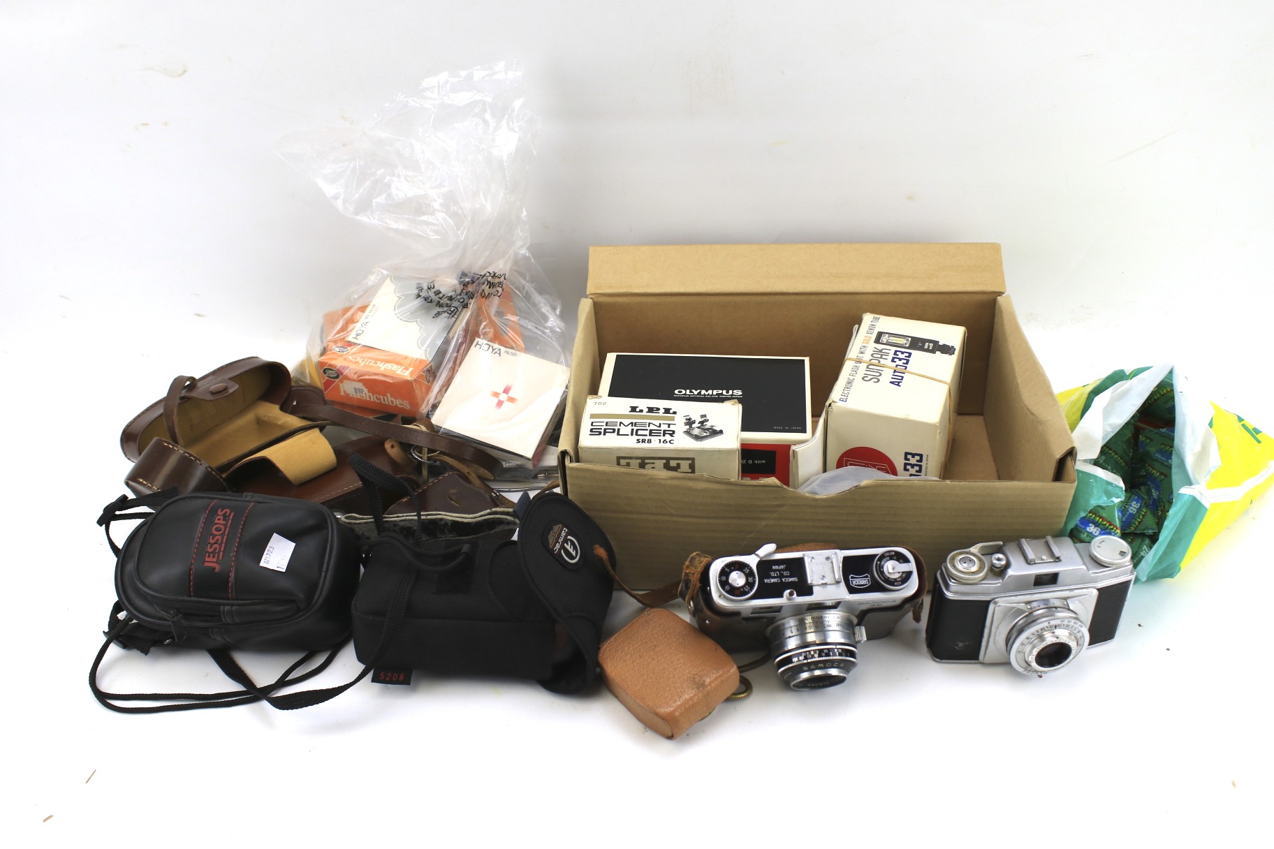 An assortment of cameras and related equipment.
