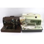 Two Singer sewing machines.