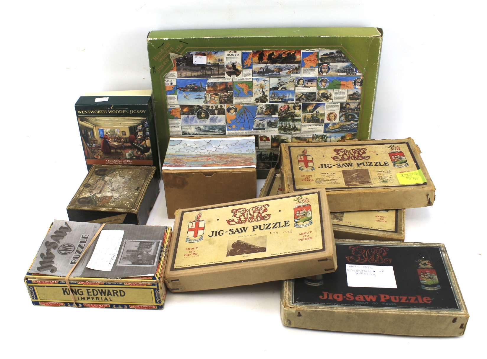 An assortment of vintage wooden jigsaw puzzles.