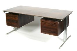 A rosewood and chrome desk, circa 1960s.