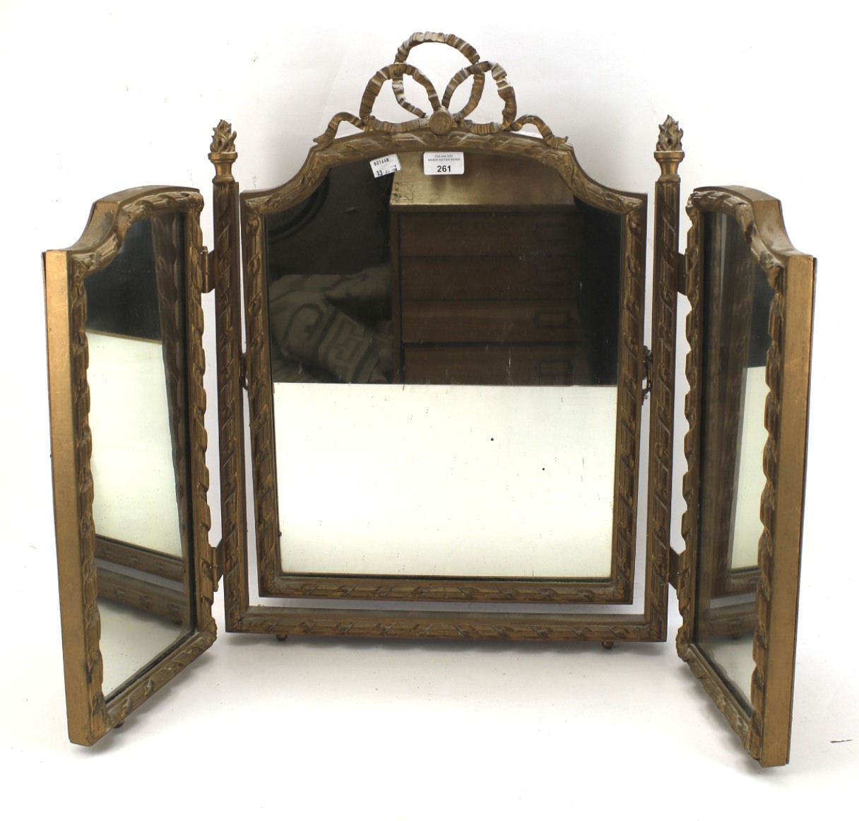 A gilt framed triptych dressing table mirror.