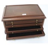 A contemporary mahogany coin storage/collector's cabinet with five shallow drawers. L45cm x D29.