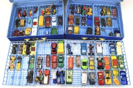 An assortment of playworn Matchbox diecast vehicles.