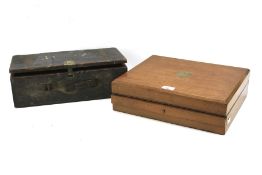 A contemporary canteen and a stained wooden box.