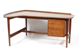 A mid-century teak Danish L-shaped desk.