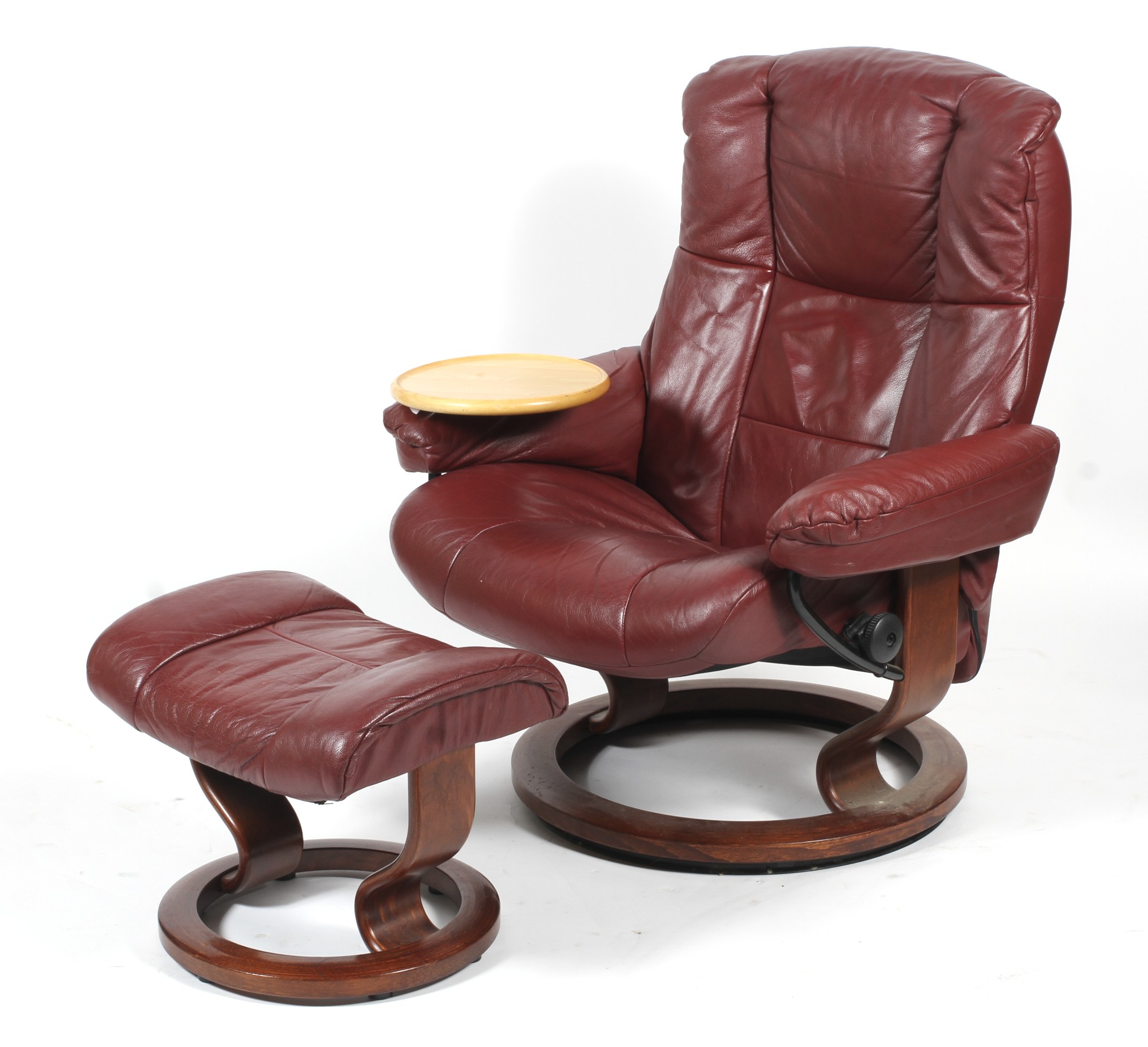 A Stressless chair with footstool.