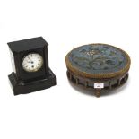 A contemporary wooden mantle clock and a Urquhart & Adamson footstool.