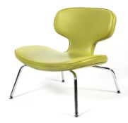 An Arti Fort retro Libel chair upholstered in green.