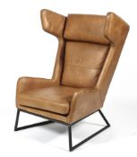 A contemporary tan leather upholstered chair.