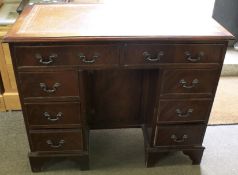 An early 20th century small mahogany double pedestal desk.