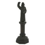 A bronze figure of John Wesley.