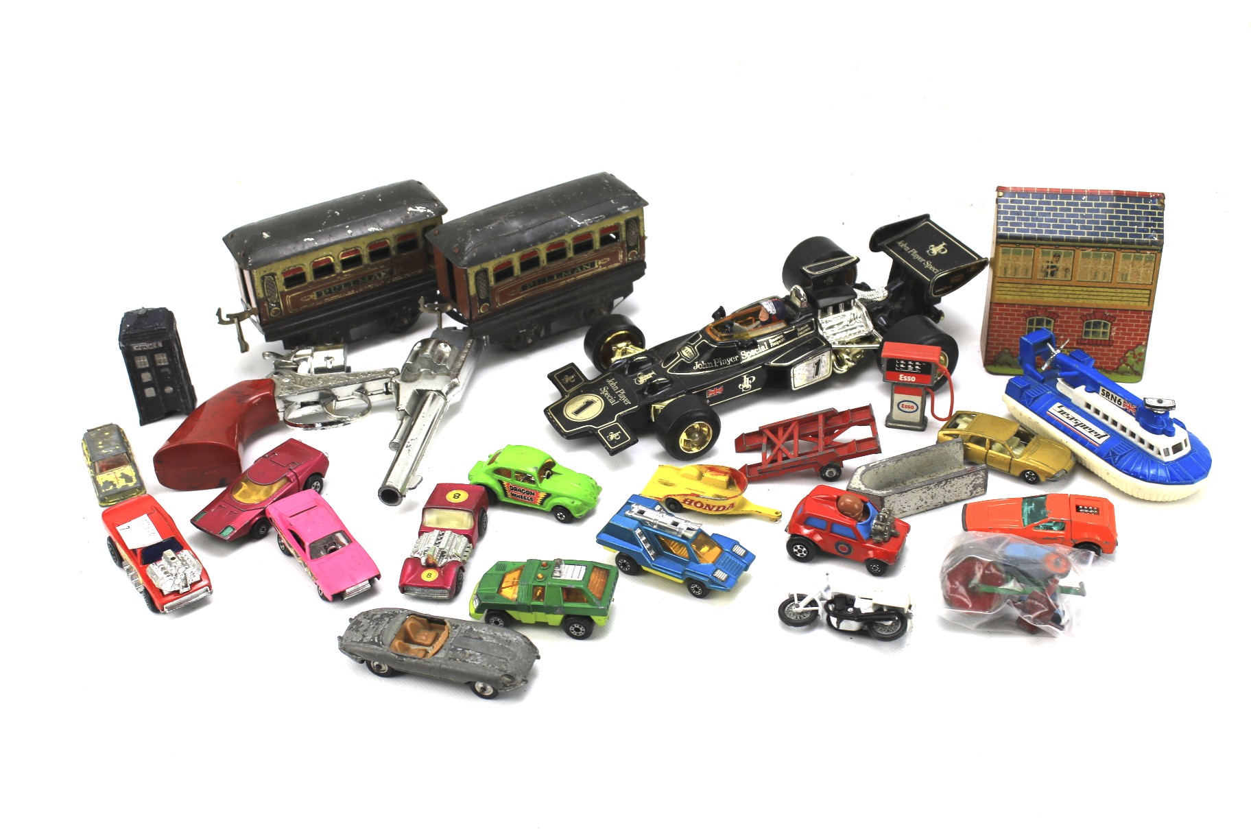 An assortment diecast model vehicles and other similar items.