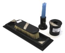 A silver mounted ebony four piece dressing table set.